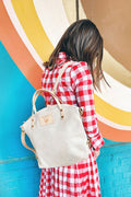 Girl wearing the Birch White Leather Convertible Backpack 2.0