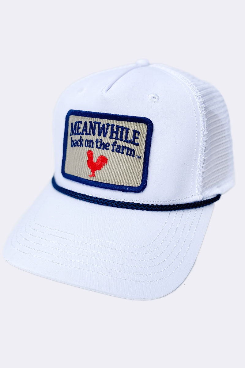 White Baseball Cap with Meanwhile Back on the Farm Embroidery