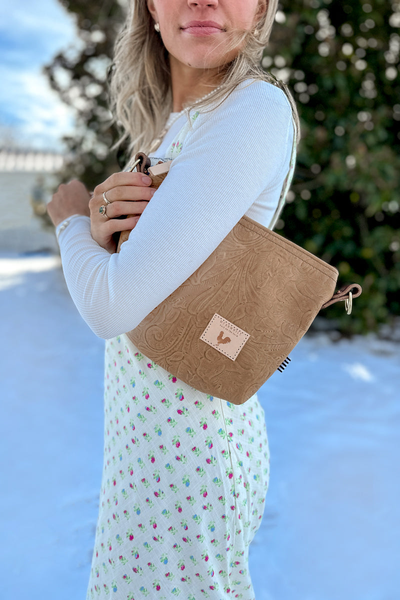 Girl wearing the Brown Leather Floral Pattern Sling Bag