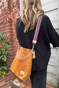 Girl wearing the Brown Vintage Birch Leather Bag with an Eggplant Italian Webbing Crossbody Strap from Meanwhile Back on the Farm