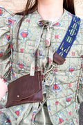 Girl wearing the Blue Aztec Italian Webbing Crossbody Strap with the Brown Leather Belt Bag