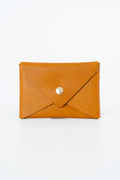 Brown leather Meanwhile Back on the Farm wallet with a button