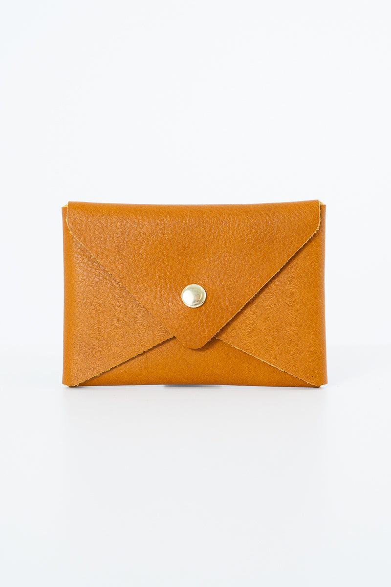 Brown leather Meanwhile Back on the Farm wallet with a button