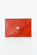 Red leather Meanwhile Back on the Farm wallet with a button