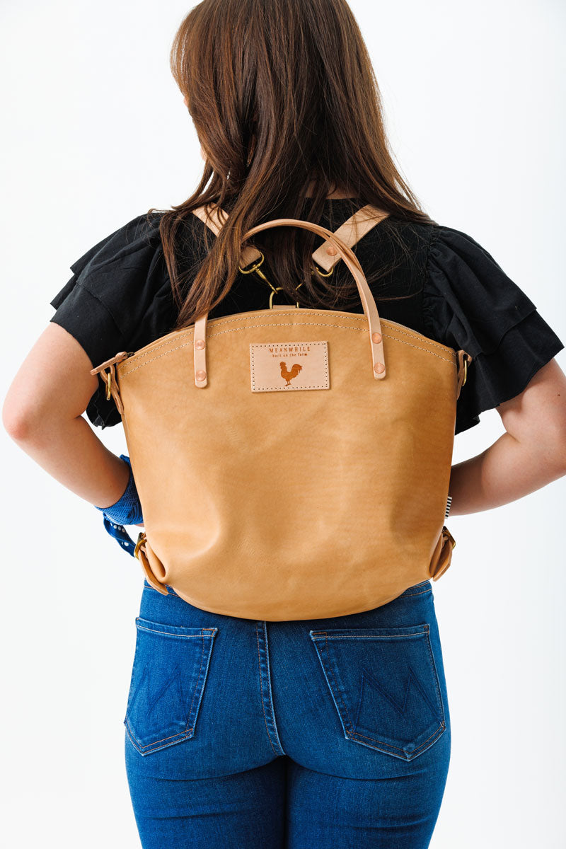 Women holding natural Virginia leather backpack 2.0