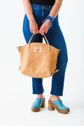 Women holding natural Virginia leather backpack 2.0