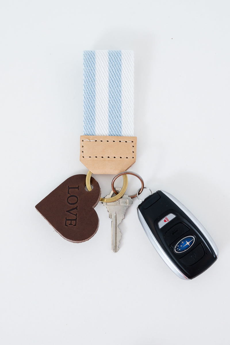 Keychain with keys, blue and white striped key fob, and a heart charm