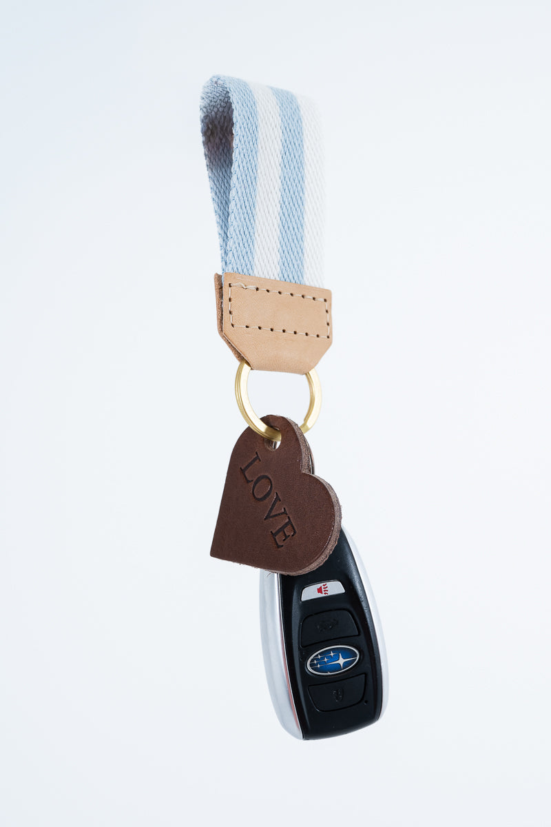 Keychain with keys, blue and white striped key fob, and a heart charm