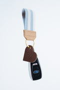 Keychain with heart-shaped charm and blue and white striped key fob