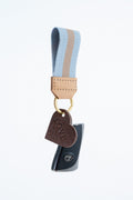 Keychain with heart-shaped charm and blue and tan striped key fob