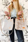 Girl holding a worn-in and new Birch White Leather Tote