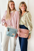 Two girls holding the Dusty Blue & Rose Leather Sling Bags