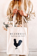 Girl holding a beige Meanwhile back on the farm tote bag with the black rooster logo and with flowers inside