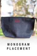 An image showing a black leather bag with a personalized monogram with the text 
