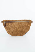 A brown embossed leather fanny pack with a horizontal zipper and a small leather tag, shown against a plain white background. Handcrafted by Meanwhile Back on the Farm in Lynchburg, Va.