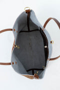 Top-down view of a tote bag interior with a light gray felt lining, brown leather trim, and gold-tone hardware on a white background. Handcrafted by Meanwhile Back on the Farm in Lynchburg, Va.