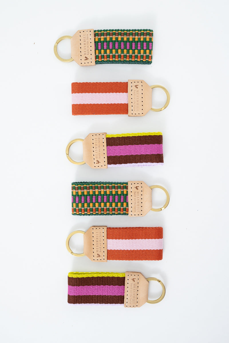 Colorful Meanwhile Back on the Farm webbing key fobs with leather accents
