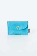 Blue snap pouch with a gold snap closure