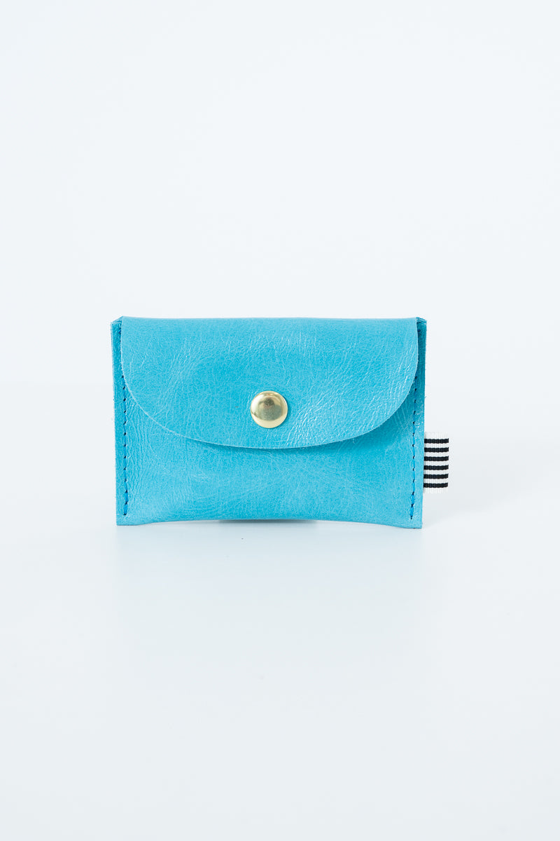 Blue snap pouch with a gold snap closure