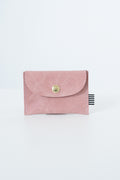 Pink snap pouch with a gold snap closure