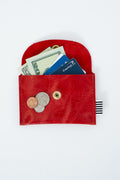 Red leather snap pouch with money, cards, and coins