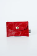 Red leather snap pouch with a gold snap closure