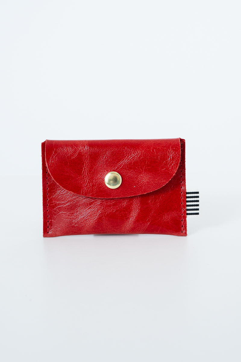 Red leather snap pouch with a gold snap closure