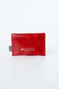 Red snap pouch with gold Meanwhile brand logo text