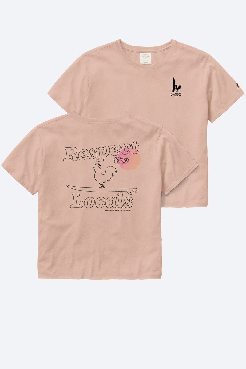 The front and back of a pink t-shirt that says respect the locals in black letters and a logo of a rooster and a surfboard