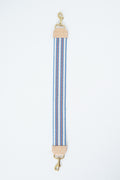 Striped webbing strap with brass hardware