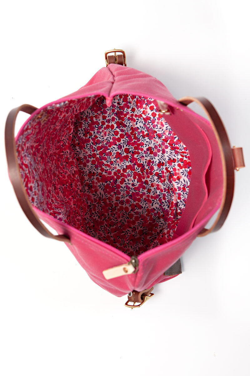 the interior of the bright pink backpack