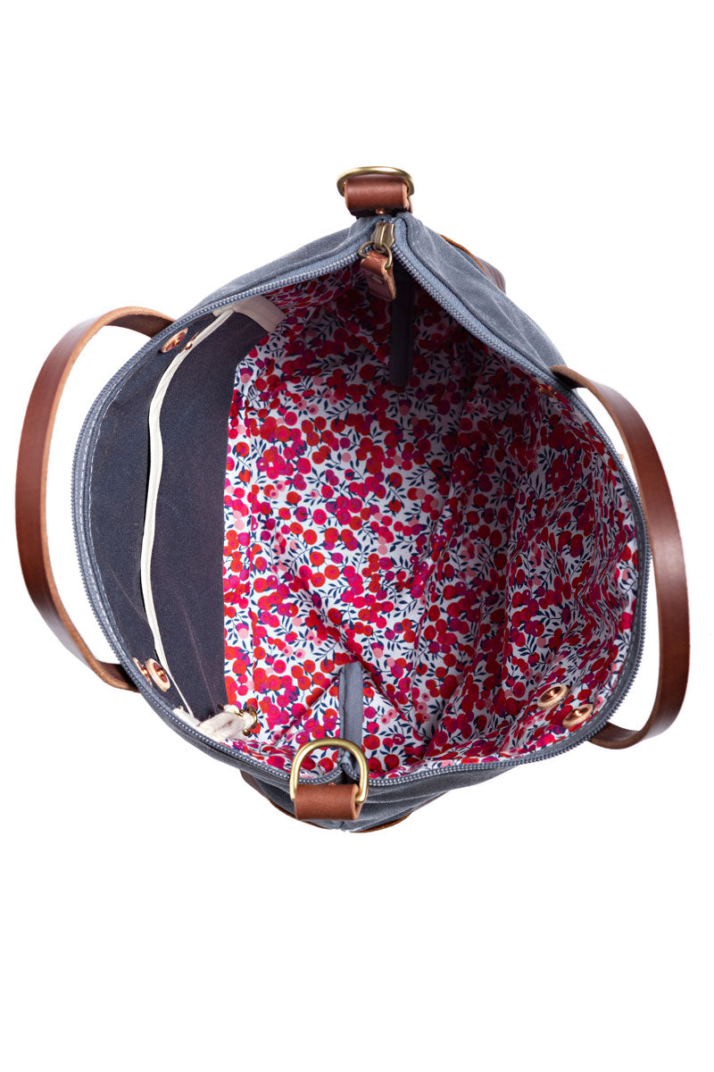 the floral interior of the slate blue hand tote bag